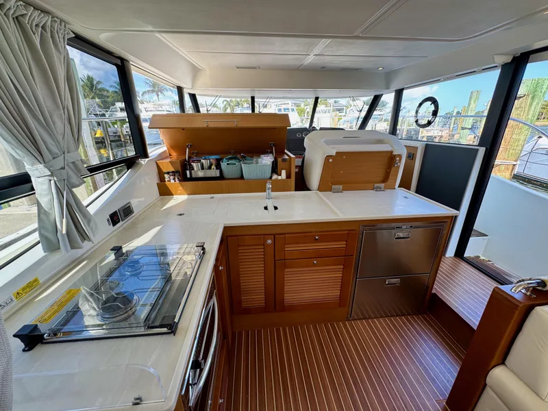 Slide: The Image of Interior of 2020 Beneteau Swift Trawler 47, featuring modern kitchen and spacious layout. - 1