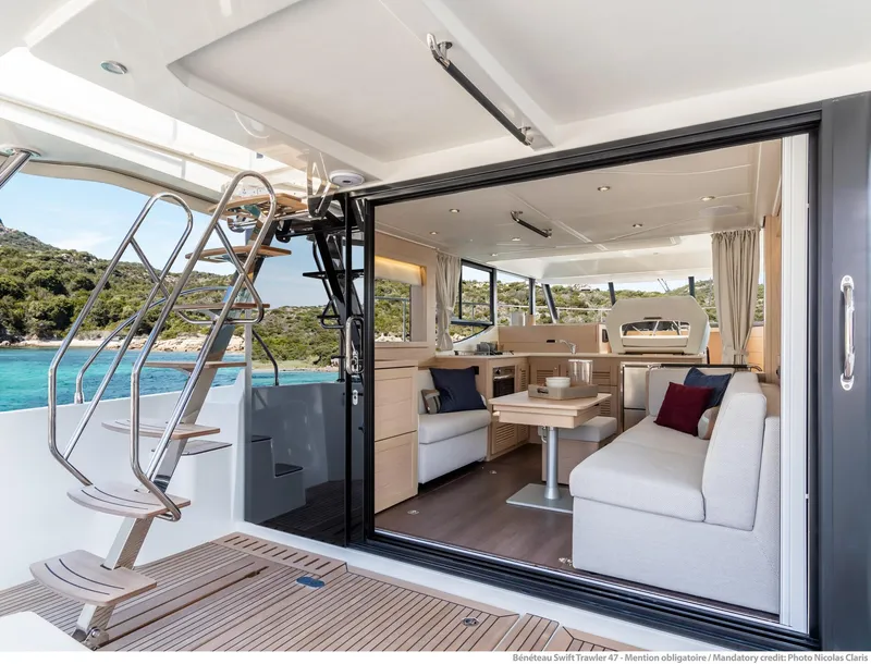Slide: The Image of Interior view of 2020 Beneteau Swift Trawler 47, featuring modern design and spacious seating. - 30