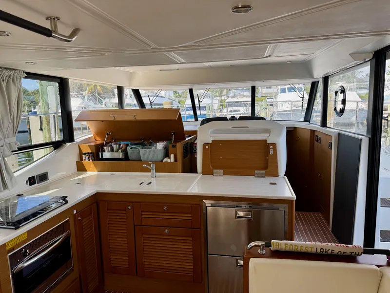 Slide: The Image of Interior of 2020 Beneteau Swift Trawler 47, featuring modern kitchen and spacious layout. - 4