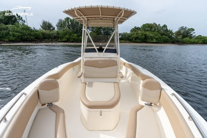 Slide: The Image of 2023 Scout 215 XSF boat on water, featuring spacious seating and sleek design. - 8