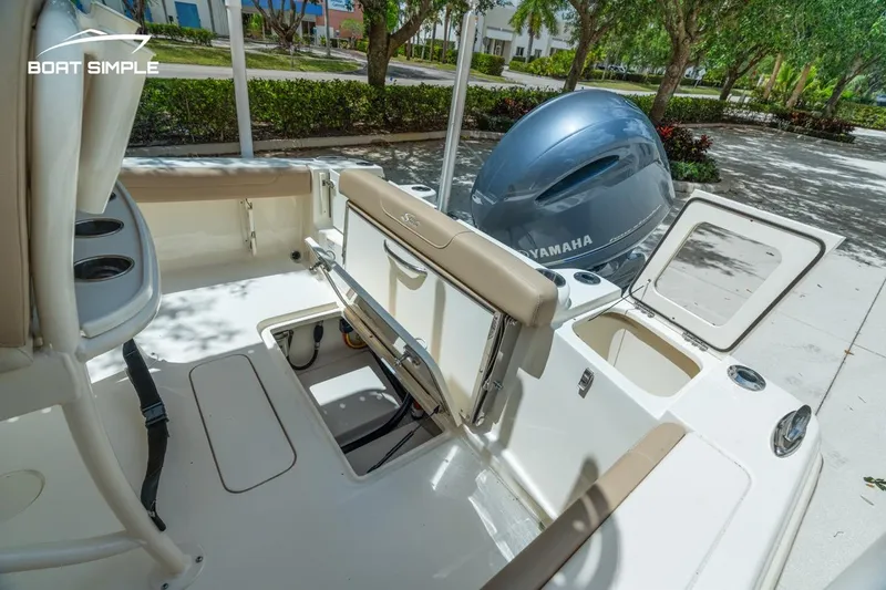 Slide: The Image of 2023 Scout 215 XSF boat interior with Yamaha engine, featuring seating and storage compartments. - 10