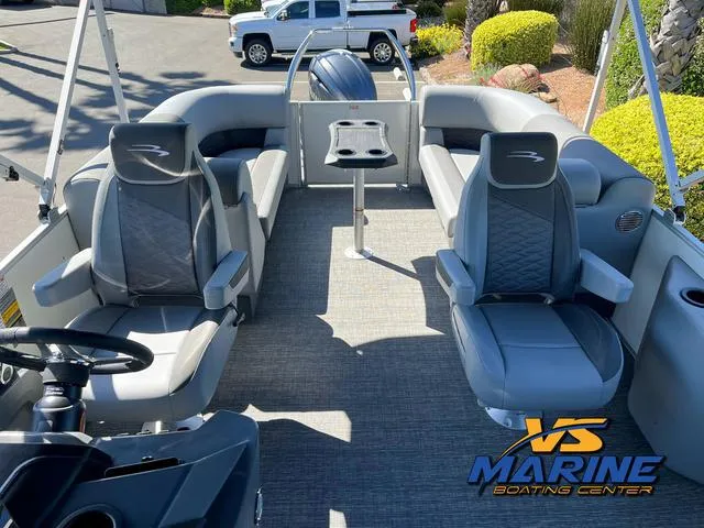 Slide: The Image of 2024 Bennington 22 SSR pontoon boat with spacious seating and canopy, displayed at VS Marine Boating Center. - 14