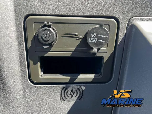 Slide: The Image of 2024 Bennington 22 SSR boat dashboard with steering wheel and navigation system. - 21