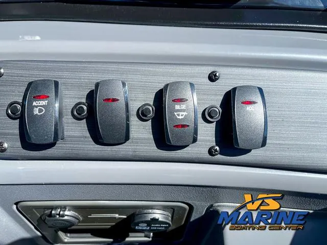 Slide: The Image of 2024 Bennington 22 SSR dashboard with 12V and USB audio input ports. - 22