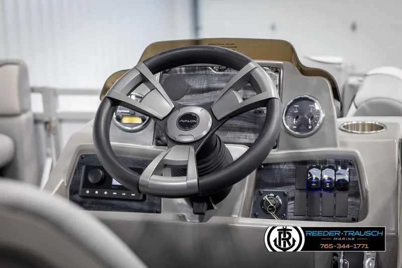 Slide: The Image of Steering console of 2025 Avalon VEN CR boat with modern controls and sleek design. - 22