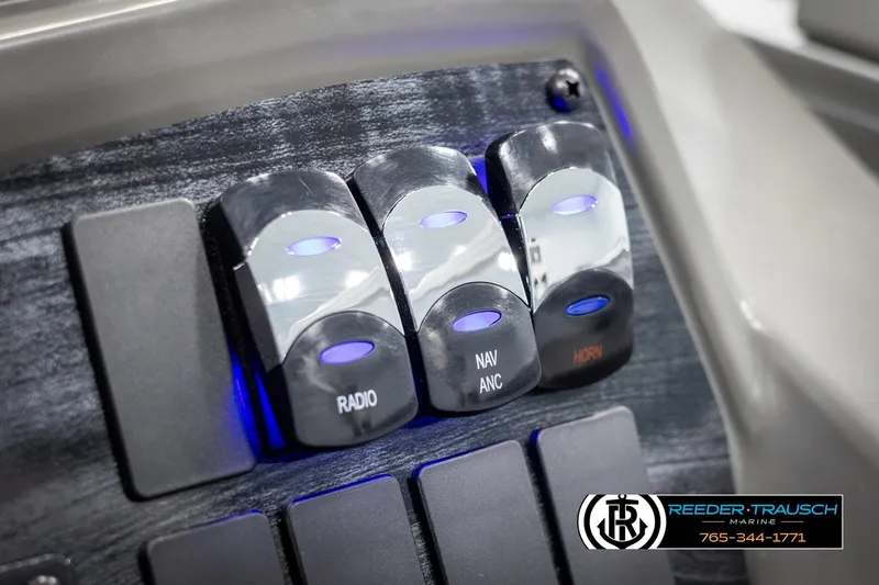 Slide: The Image of Control panel of 2025 Avalon VEN CR boat with radio, navigation, and horn switches. - 28