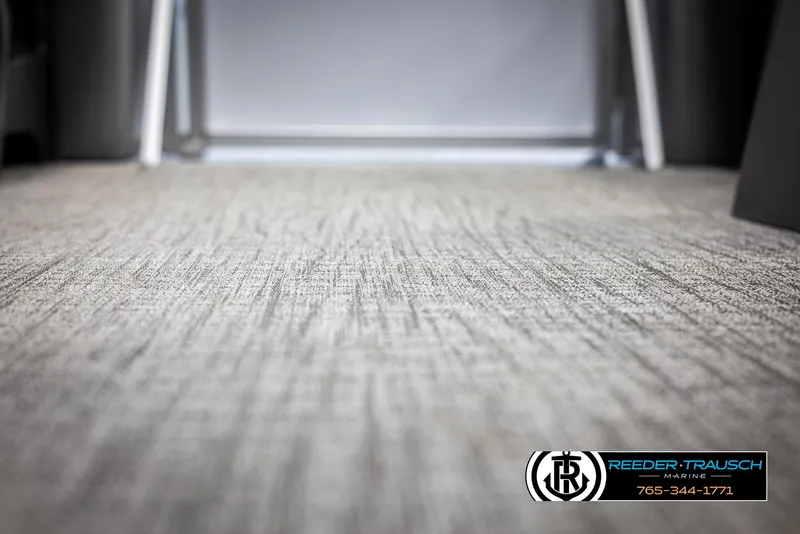 Slide: The Image of Carpeted interior of 2025 Avalon VEN CR boat, featuring textured flooring. - 36