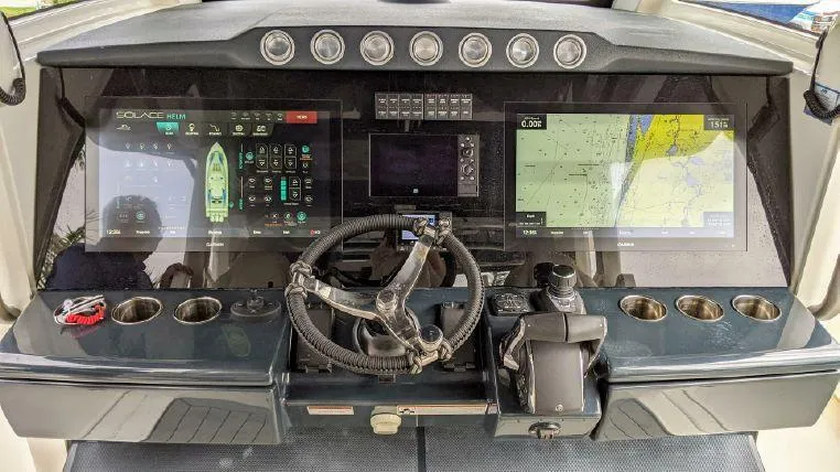 Slide: The Image of 2022 Solace 41 CS boat dashboard with advanced navigation and control systems. - 4