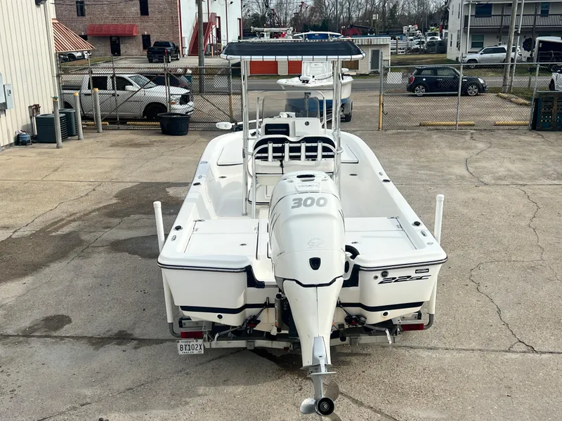Slide: The Image of 2015 Epic 22 Sport Console boat with 300 HP engine, parked in a lot. - 10