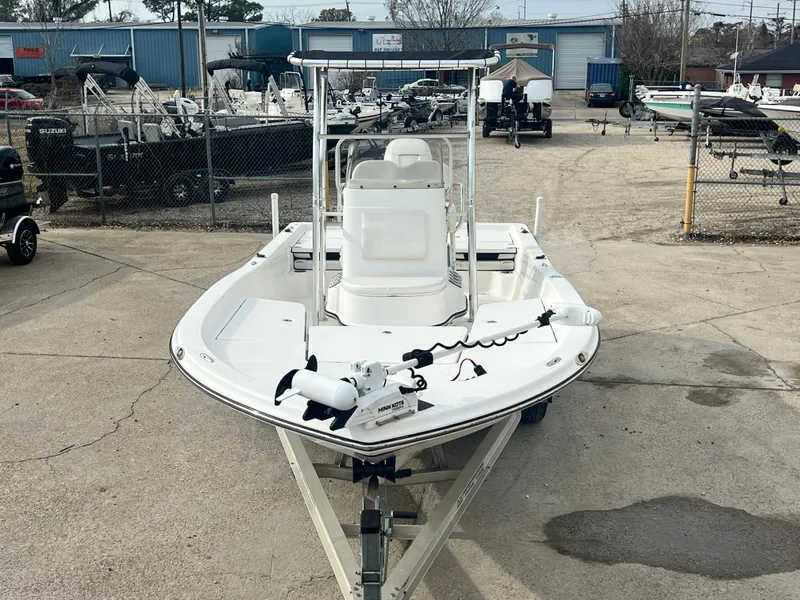 Slide: The Image of 2015 Epic 22 Sport Console boat in a marina setting, front view. - 6