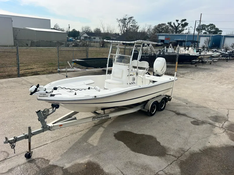 Slide: The Image of 2015 Epic 22 Sport Console boat on trailer in outdoor storage area. - 7