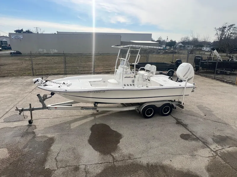 Slide: The Image of 2015 Epic 22 Sport Console boat on trailer in outdoor lot. - 8