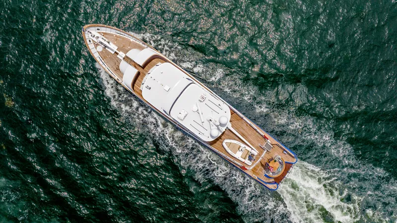 Slide: The Image of Aerial view of 1975 Stephens Brothers Expedition yacht cruising through ocean waters. - 16