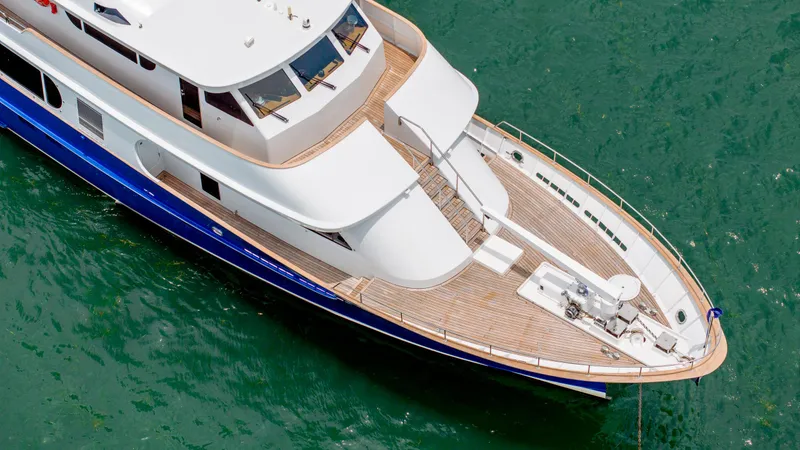 Slide: The Image of Aerial view of 1975 Stephens Brothers Expedition yacht on green water. - 18