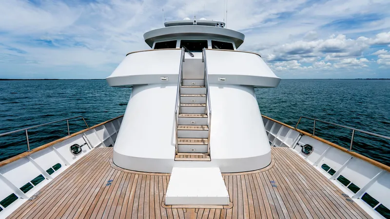 Slide: The Image of 1975 Stephens Brothers Expedition yacht deck with wooden flooring and ocean view. - 23