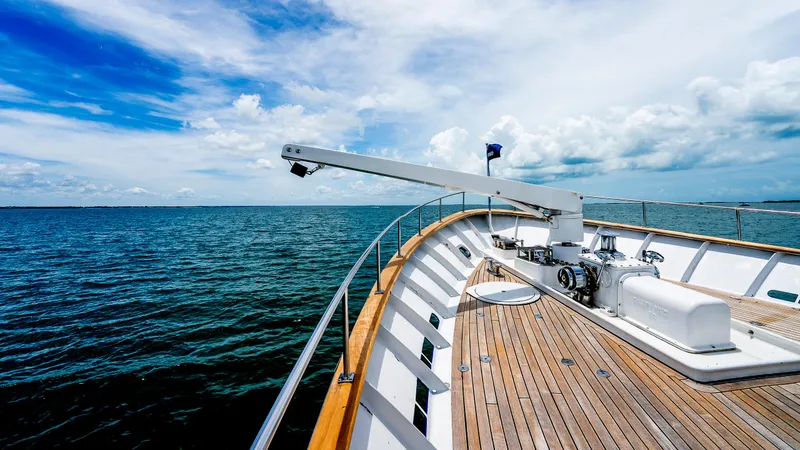 Slide: The Image of 1975 Stephens Brothers Expedition yacht deck with ocean view under blue sky. - 25