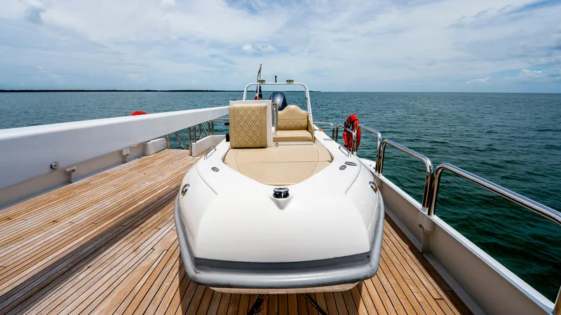 Slide: The Image of 1975 Stephens Brothers Expedition boat on deck, ocean view, clear sky, wooden flooring. - 35