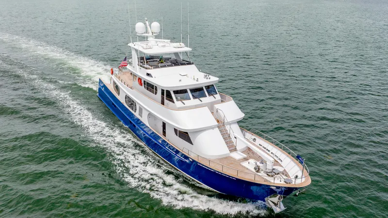 Slide: The Image of 1975 Stephens Brothers Expedition yacht cruising on open water, showcasing sleek design and luxury. - 5