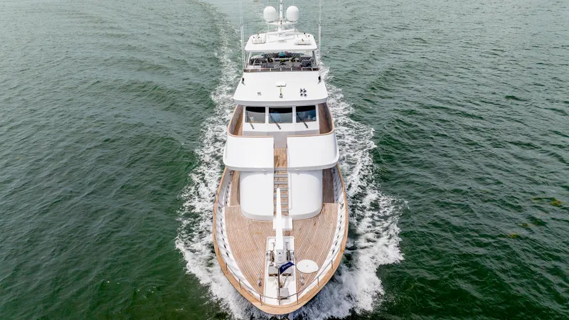 Slide: The Image of 1975 Stephens Brothers Expedition yacht cruising on open water, aerial view. - 6