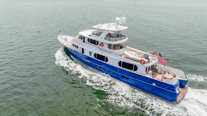 Slide: The Image of Aerial view of 1975 Stephens Brothers Expedition yacht cruising on open water. - 9