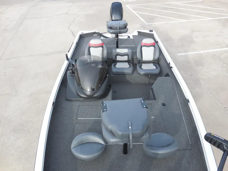Slide: The Image of 2017 Lowe Stinger 175 boat interior with seating and steering console. - 10