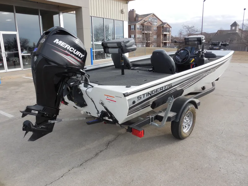Slide: The Image of 2017 Lowe Stinger 175 boat with Mercury engine on trailer, parked outdoors. - 3