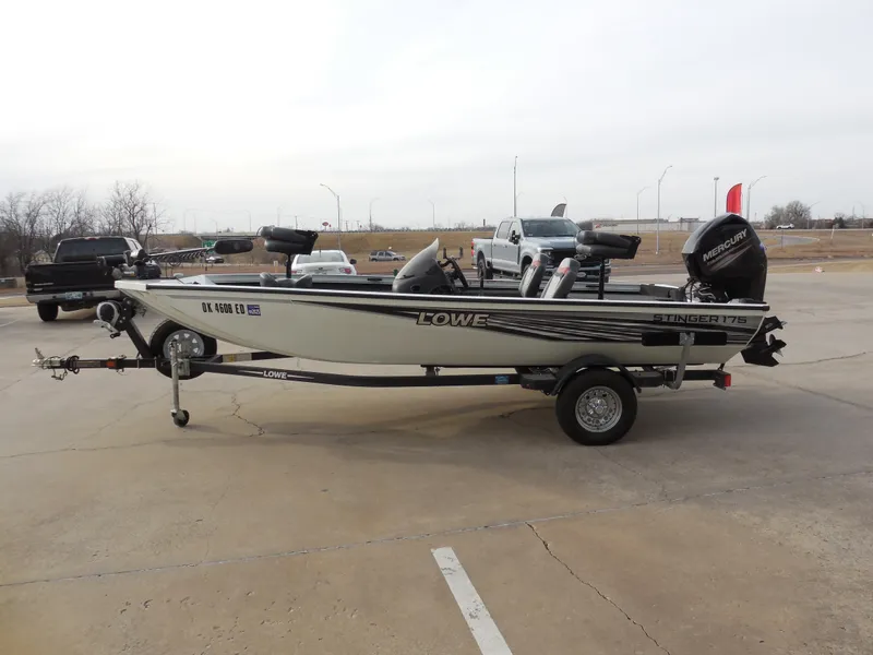 Slide: The Image of 2017 Lowe Stinger 175 fishing boat on trailer in parking lot. - 5