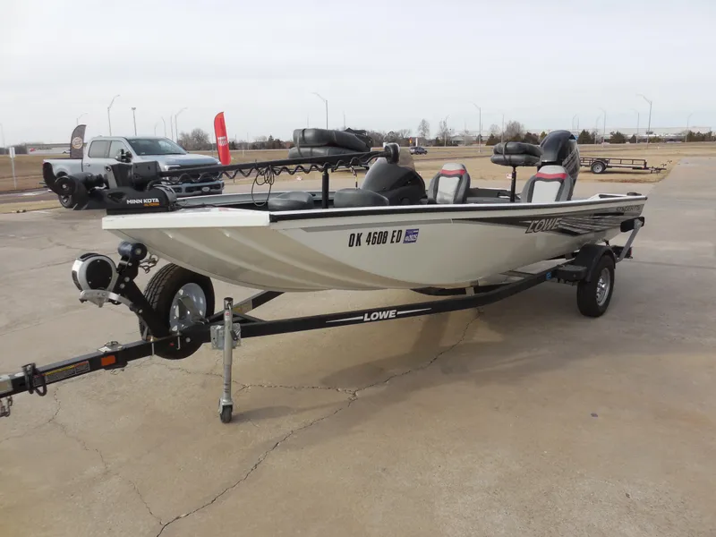 Slide: The Image of 2017 Lowe Stinger 175 boat on trailer in parking lot. - 6