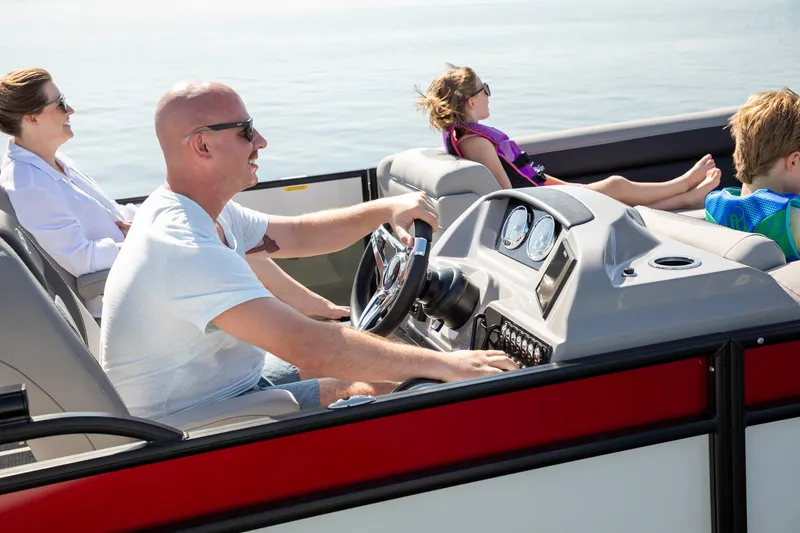 Slide: The Image of Family enjoying a ride on a 2025 Barletta Aria 24UC pontoon boat. - 4