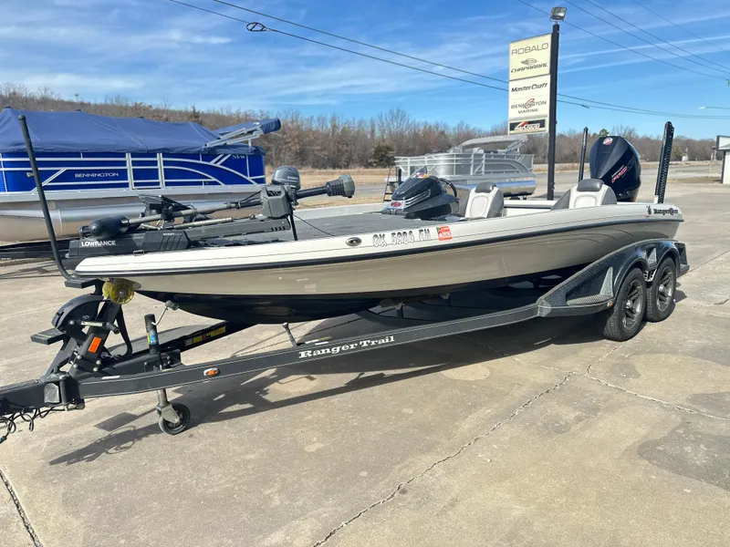 Slide: The Image of 2021 Ranger Z520C fishing boat on trailer in outdoor setting. - 2