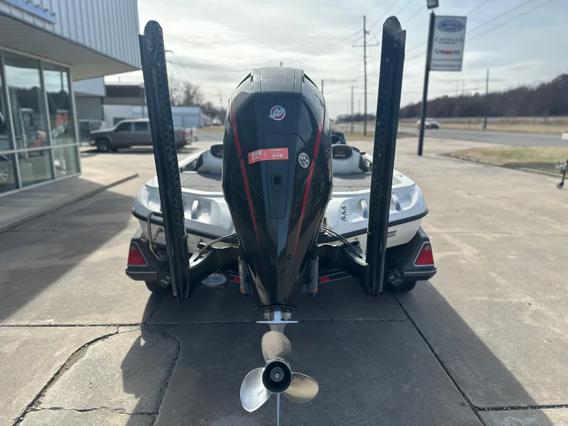 Slide: The Image of 2021 Ranger Z520C boat with outboard motor, parked outside a dealership. - 3