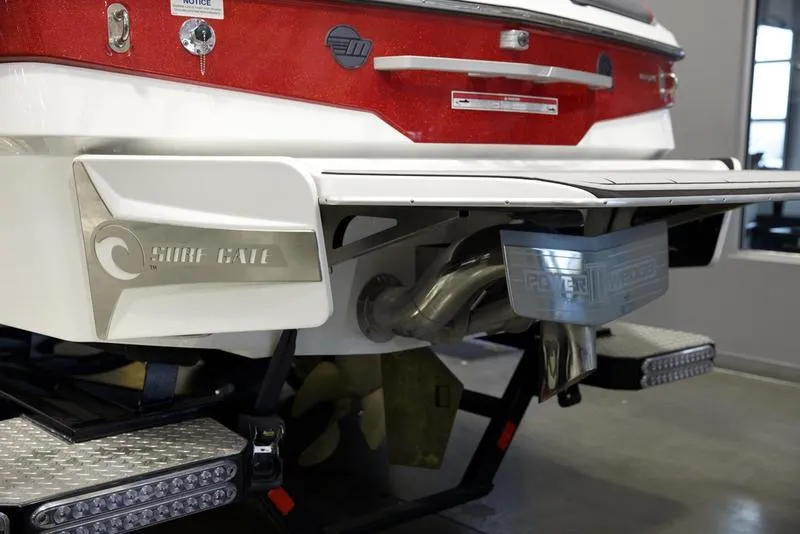 Slide: The Image of 2021 Malibu 25 LSV boat rear view with Surf Gate and exhaust system. - 5