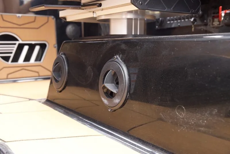 Slide: The Image of 2025 Malibu 25 LSV boat interior detail with speaker system and sleek design elements. - 15