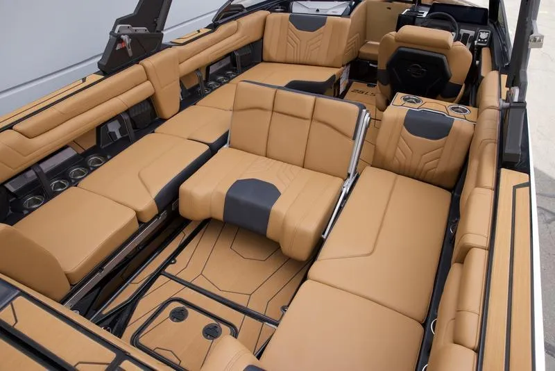 Slide: The Image of Luxurious interior of 2025 Malibu 25 LSV boat with tan leather seating. - 18