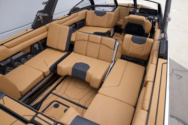 Slide: The Image of Luxurious interior of 2025 Malibu 25 LSV boat with tan leather seating. - 19