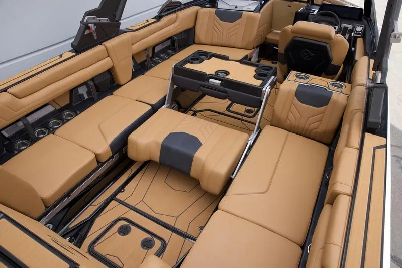 Slide: The Image of Luxurious interior of 2025 Malibu 25 LSV boat with tan leather seating and modern design. - 20