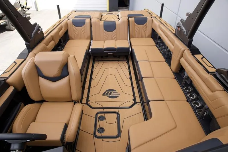 Slide: The Image of Luxurious interior of 2025 Malibu 25 LSV boat with tan leather seating. - 24