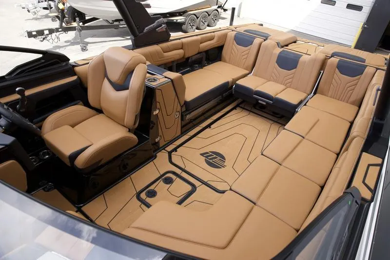 Slide: The Image of Luxurious interior of 2025 Malibu 25 LSV boat with tan leather seating. - 3