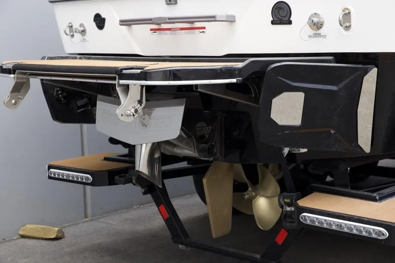 Slide: The Image of 2025 Malibu 25 LSV boat stern with propeller and swim platform details. - 5