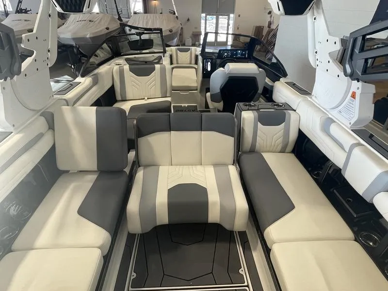 Slide: The Image of 2025 Malibu 25 LSV boat interior with luxurious seating and modern design. - 25