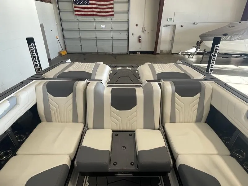 Slide: The Image of Interior of 2025 Malibu 25 LSV boat with gray and white seating. - 27