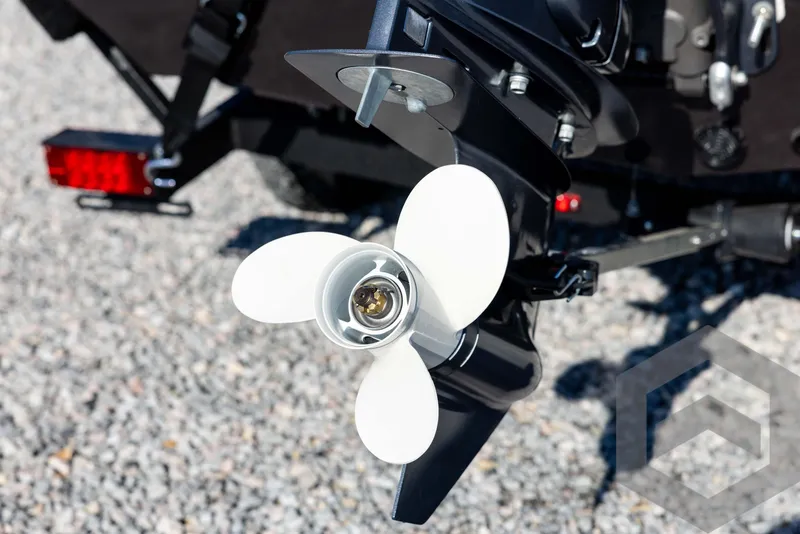 Slide: The Image of 2025 G3 Sportsman 1610 boat propeller on gravel surface. - 20