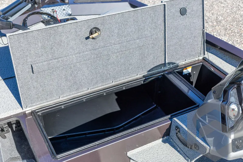 Slide: The Image of 2025 G3 Sportsman 1610 boat storage compartment open, showcasing interior space. - 32