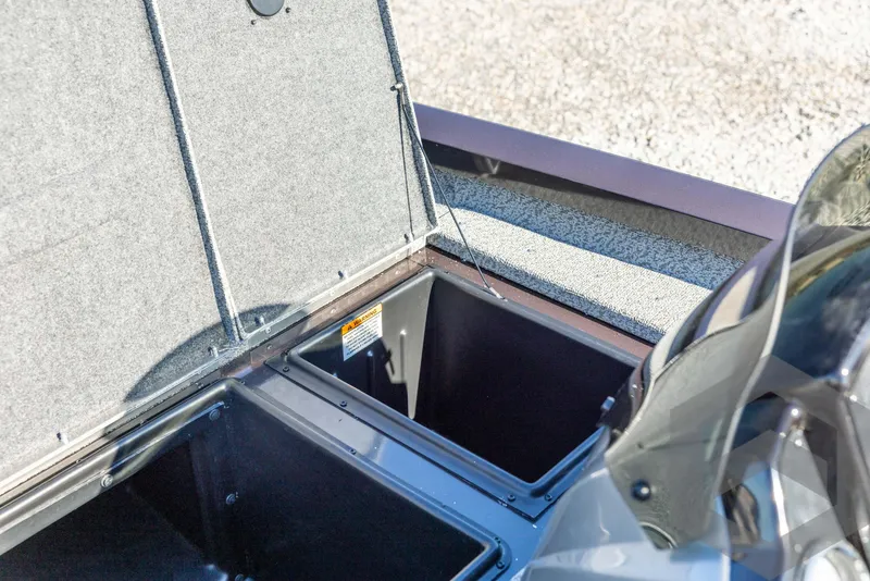 Slide: The Image of Open storage compartments on a 2025 G3 Sportsman 1610 boat. - 33