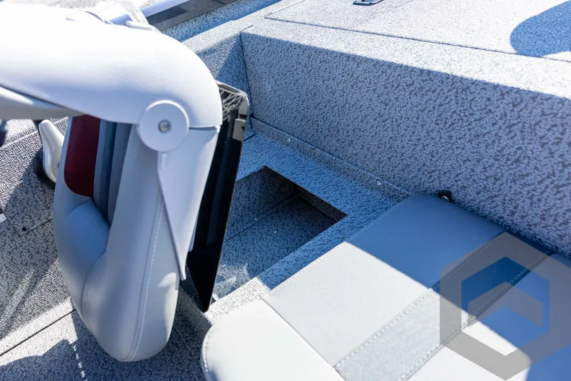 Slide: The Image of 2025 G3 Sportsman 1610 boat interior with gray seating and storage compartment. - 42
