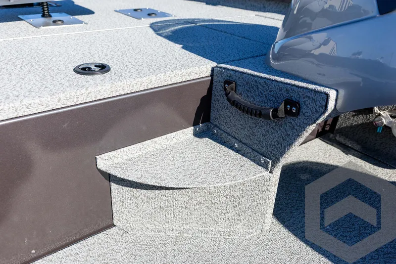 Slide: The Image of 2025 G3 Sportsman 1610 boat interior with textured flooring and storage compartment. - 49