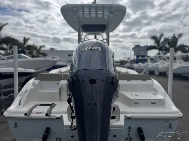 Slide: The Image of 2021 Key West 219fs boat with 200 horsepower engine, docked at a marina. - 4