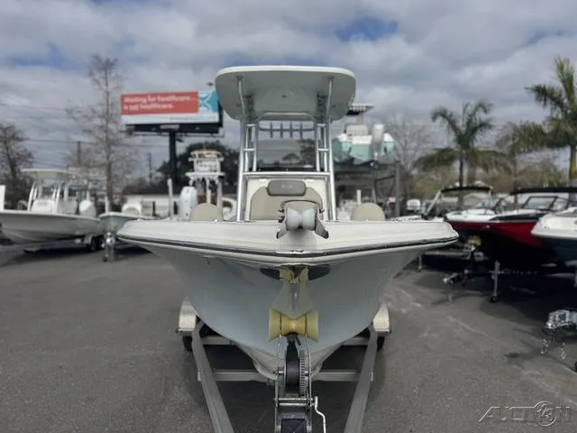 Slide: The Image of 2021 Key West 219fs boat on trailer, displayed outdoors with other boats. - 9