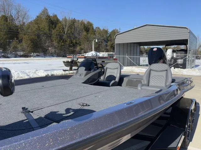 Slide: The Image of 2025 iKon VLX20 boat with dual seats, parked outdoors in snowy setting. - 11