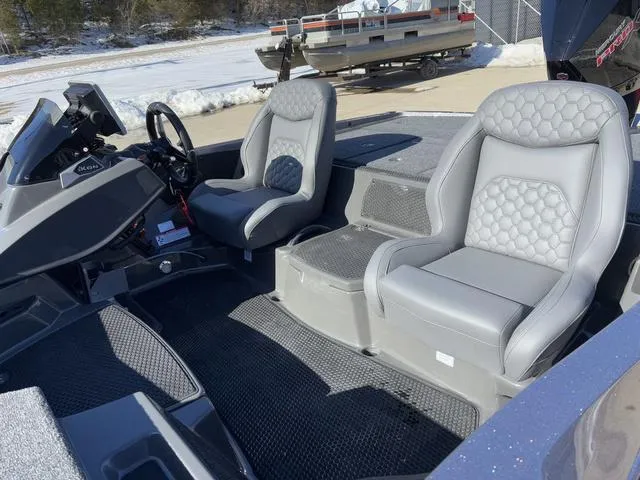 Slide: The Image of 2025 iKon VLX20 boat interior with gray leather seats and modern dashboard. - 12